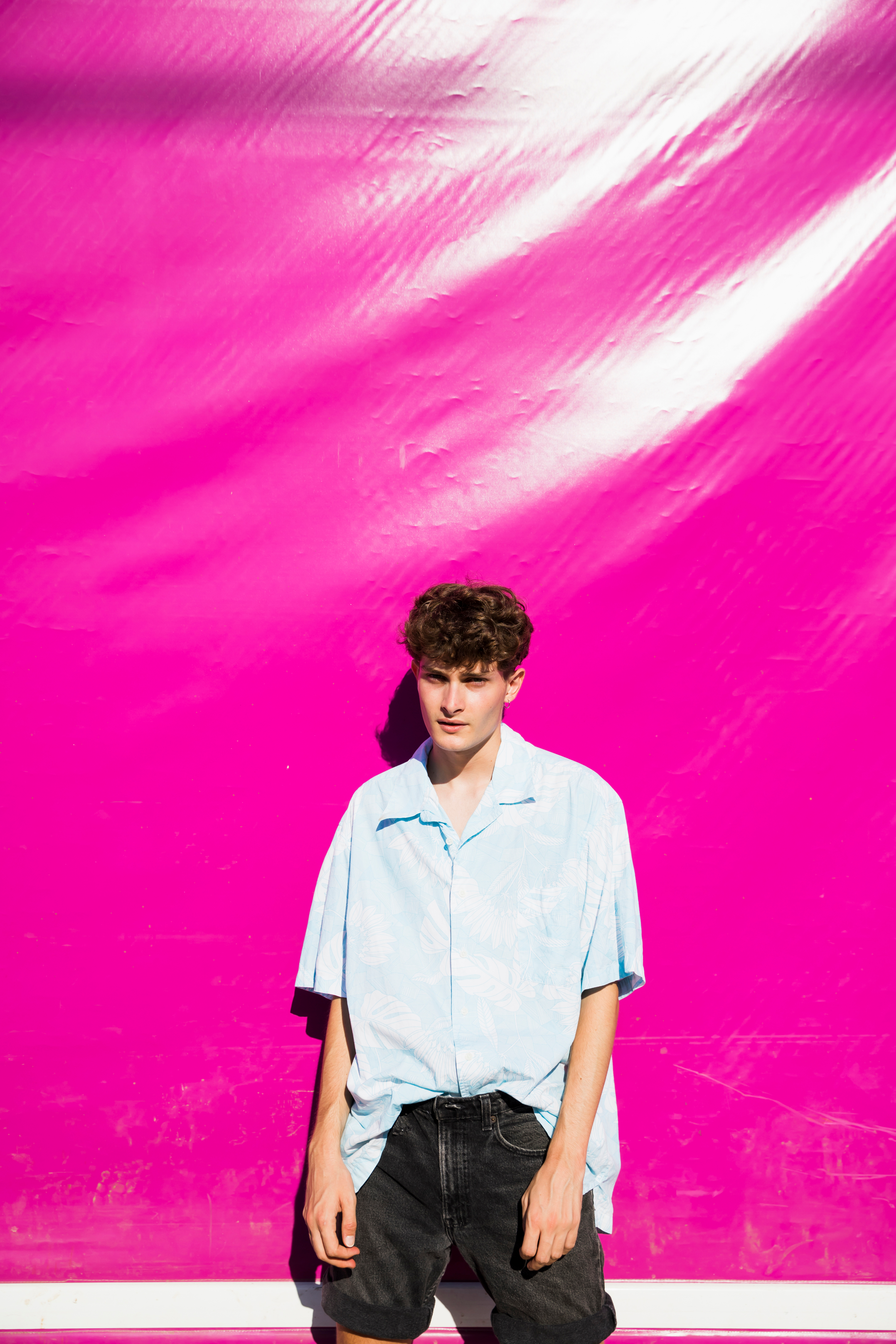 HANDSOME_MAN_PORTRAIT_WITH_PINK_BACKGROUND